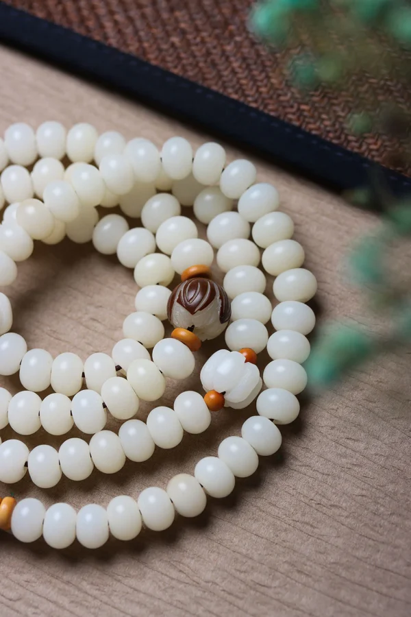 White Jade Bodhi 108 Mala Beads Bracelet with Hand-Carved Lotus Beads and Olive Pit Spacers - Image 2